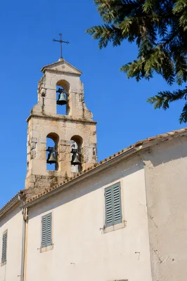 Historic Church Bell Tower Under Blue Sky