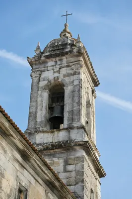 Historic Church Bell Tower Under Blue Sky