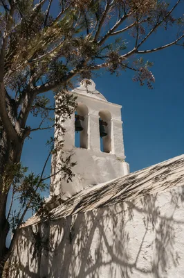 White Church Bell Tower Under Blue Sky
