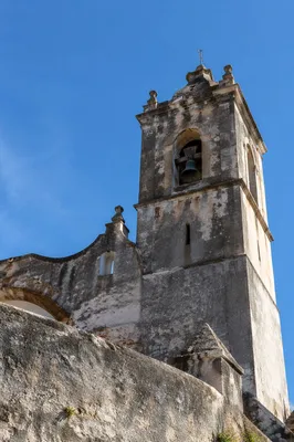 Old Stone Church Bell Tower Under Blue Sky