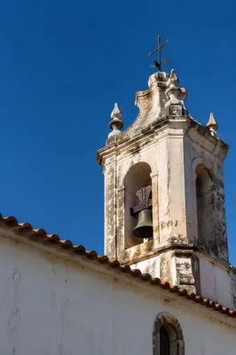 Historic Church Bell Tower Under Blue Sky