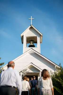 White Church Bell Tower Under Blue Sky