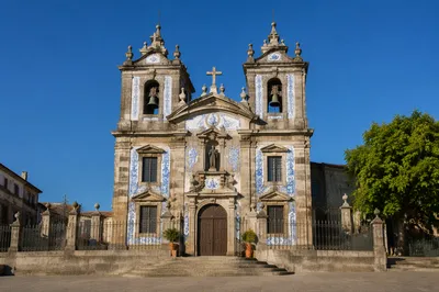 Historic Church Bell Towers Under Blue Sky