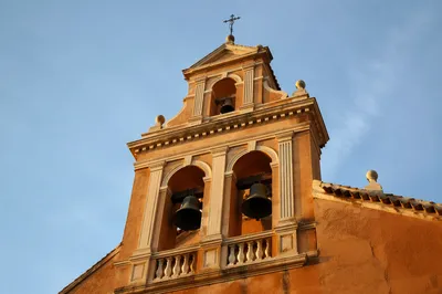 Historic Church Bell Tower Under Blue Sky