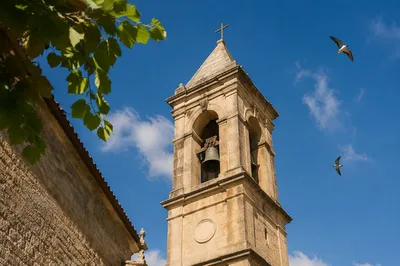Stone Church Bell Tower Under Blue Sky