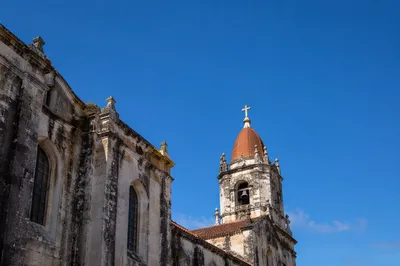 Historic Church Bell Tower Under Blue Sky