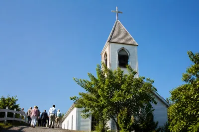 White Church Bell Tower Under Blue Sky
