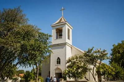 White Church Bell Tower Under Blue Sky