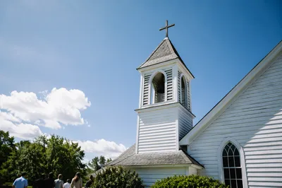 White Church Bell Tower Under Blue Sky