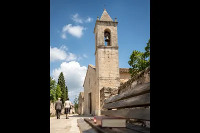 Stone Church Bell Tower Under Blue Sky