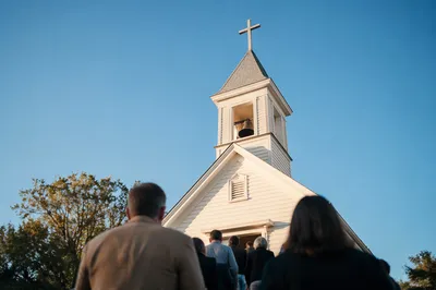 White Church Bell Tower Under Blue Sky