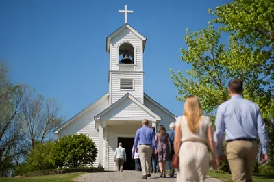 White Church Bell Tower Under Blue Sky