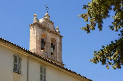 Historic Church Bell Tower Under Blue Sky