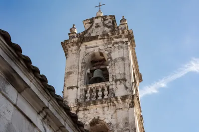 Historic Church Bell Tower Under Blue Sky