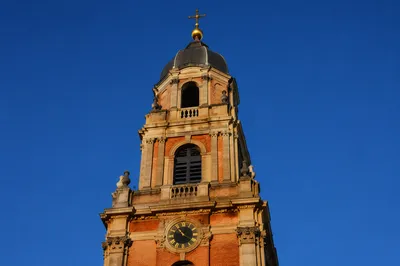 Historic Church Bell Tower Under Blue Sky