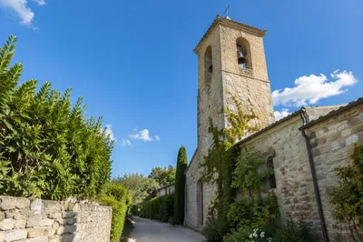 Stone Church Bell Tower Under Blue Sky