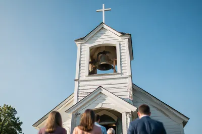 White Church Bell Tower Under Blue Sky