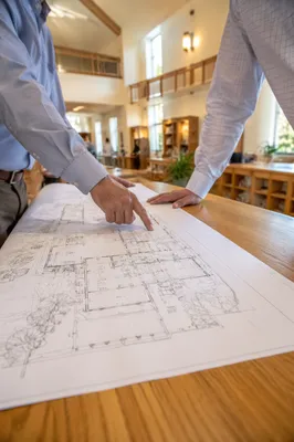 Church Building Committee Reviewing Blueprints
