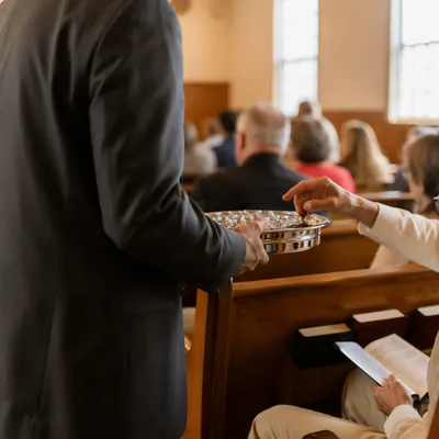 Deacon Serving Communion in Quiet Sanctuary