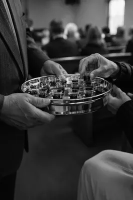 Deacon Serving Communion in Quiet Sanctuary