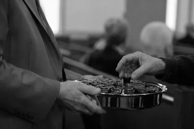 Deacon Serving Communion in Quiet Sanctuary