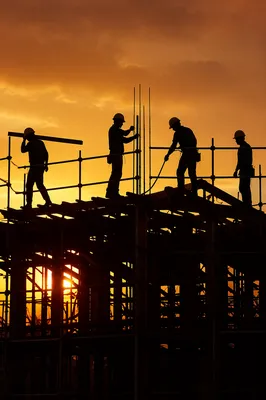 Church Volunteers Building Homes at Sunset