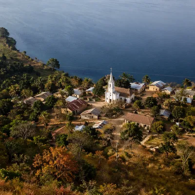 Rural Lakeside Village Church at Sunset