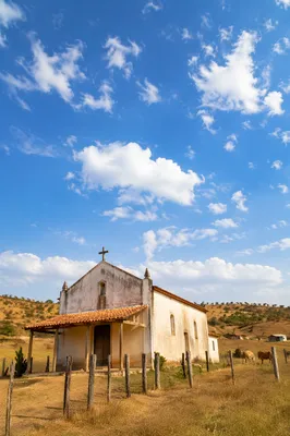 Rural Village Chapel Under Bright Blue Sky