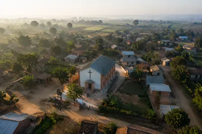 Rural Village Church at Misty Sunrise