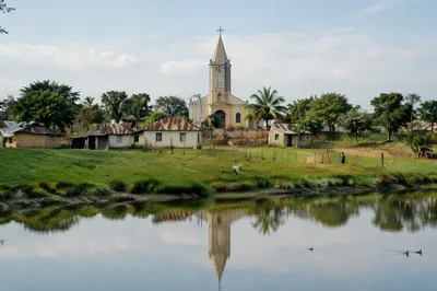 Rural Village Church Reflected in Peaceful Pond