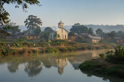 Rural Village Church Across Quiet River