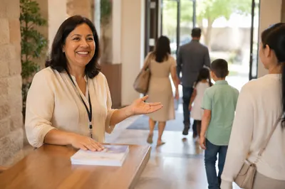 Smiling Woman at Church Welcome Desk