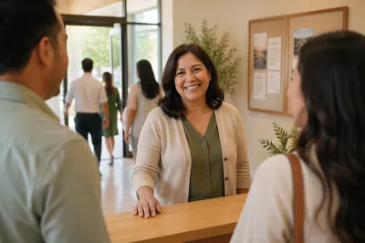 Smiling Woman at Church Welcome Desk