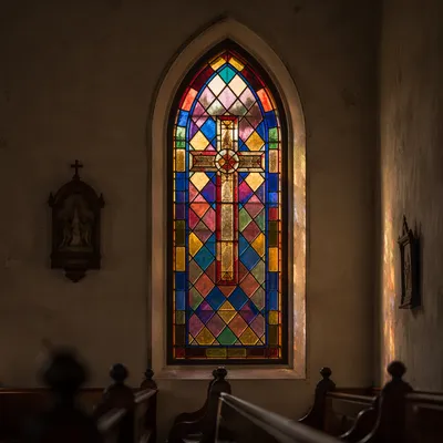 Sunlit Stained Glass Chapel Pews
