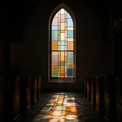 Sunlit Church Pews by Stained Glass