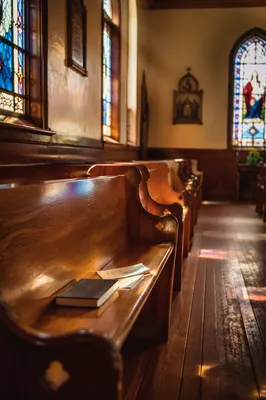 Sunlit Church Pews with Stained Glass