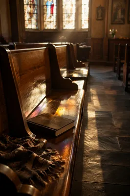 Sunlit Chapel Pews with Stained Glass