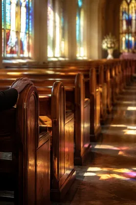 Sunlit Church Pews with Stained Glass