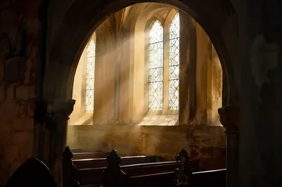 Sunlit Pews in Historic Church Nave