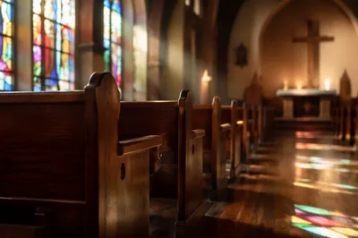 Sunlit Church Pews with Stained Glass