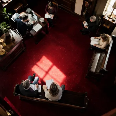 Church Staff Planning Meeting Over Red Carpet