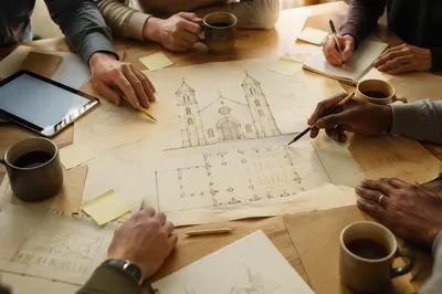 Church Staff Planning Meeting With Floor Plans