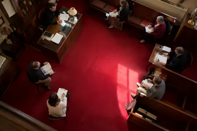 Church Staff Planning Meeting Over Red Carpet