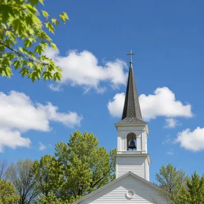 White Church Steeple Under Blue Sky