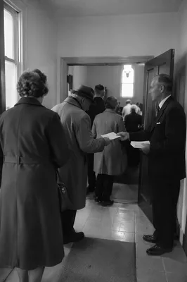 Church Usher Welcoming Worshipers at Door