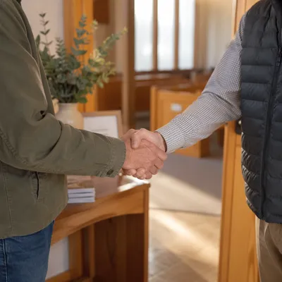 Warm Church Welcome Handshake at Entrance