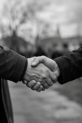 Warm Church Welcome Handshake in Monochrome
