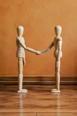Warm Church Welcome Handshake With Wooden Figures