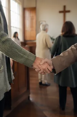 Warm Church Welcome Handshake in Chapel Foyer