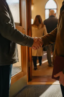 Warm Church Welcome Handshake at Chapel Doorway